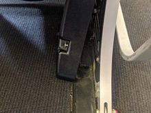 loose screw and plastic cover under the seat in front of mine