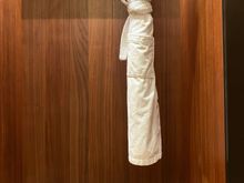 Luggage and coat storage at the entrance of room 6