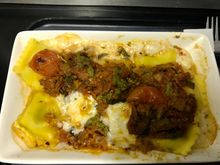 Spinach and ricotta ravioli with tomato sauce, pesto and bocconcini  