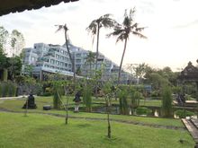 The hotel seen from the greens: its shape mirrors the borobudor temple