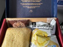 4” ham sandwich, chips, and sweet cookie 



