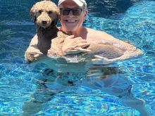 More than fetch, keep away and riding on a floatie, Poppy likes to be held in the pool!