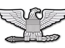 This is the Army eagle symbol for O6 rank. Some have the eagle head turned the opposite way