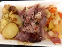 Ham hock with parsley sauce, roast potatoes and root vegetables