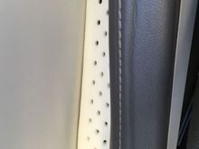 Arm rest and fuselage wall.