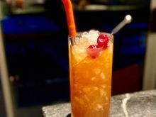 Nui Nui (1937 Version) - Rum (Demerara, Jamaican rum &cachaça), Orange and Lime juices, Cinnamon and Vanilla syrups, St. Elizabeth Dram and Jamaican bitters. 