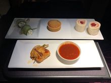 Snack platter selection (smoked salmon, cheese and pimento roll, piri piri chicken skewer, mini treacle tart, piri piri sauce)
