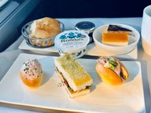 Prawn Marie Rose on brioche, 
Roasted vegetables and hummus on white bread,
Roast beef with horseradish on brioche

Scones, clotted cream and jam

Passion fruit cheesecake and Opéra cake
