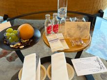 Some fruit, water, cider, and snacks.