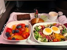 Arrival meal, chopped salad, green goddess dressing.  Fruit bowl and brownie.