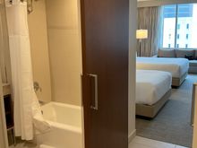 The bathroom has a sliding door