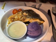 Preordered the sea bass.  Everyone is always raving about the fish on AA, and I'm a big seafood guy, but I was disappointed with this main and the last time I had fish on an AA transatlantic flight.  The portion size was generous, but the fish was a bit too dry and fishy, and the sauce was richer than I'd like.  I didn't care for the purple mash.  I should have gotten the chicken kabsa or Indian meal.