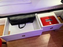 Storage space and the safe. The tv remote can be found here. You can control the tv from the iPad also.