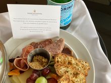 Welcome amenity: hearty plate + San Pelligrino delivered to the room 
