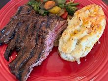 Skirt steak (flap meat from Costco) brushed with Sweet Baby Ray’s and grilled, with twice baked potatoes (from KC Cattle Co. - don’t bother) and sautéed veggies. 