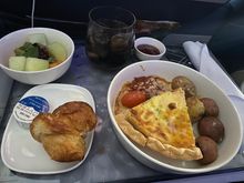 This was the “Cheddar and Chive Quiche” served earlier this week from SEA-ATL. Overall a solid breakfast. Not the best I’ve ever had, but certainly not the worst. Portion was generous and flavorful. Potatoes were a bit bland and could’ve used a meat element like bacon or sausage to add a break from all the starchy elements. Croissant was excellent as well as the banner butter and jam. Would recommend! 

FEBO followed on an odd flight, though I had preselected. Other choices were French toast o