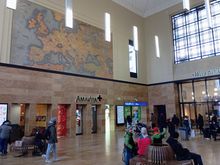 The main hall of Cornavin train station in Geneva - the doorway-like openings used to be ticket counters 