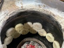Stuck against the clay oven