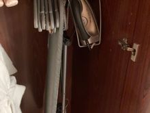 Bathrobe, slippers, iron and board 