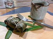 Sweet rice with red bean wrapped in a lotus leaf