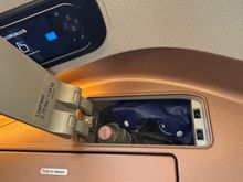 IFE controls, earphones and water bottle 
