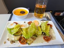 “Roasted vegetable salad” with passion fruit panna cotta and an olive roll (which appeared later)