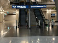 Follow the signs to the airport railway from inside the terminal and then signs to long term parking. You should be walking away from the airport. 