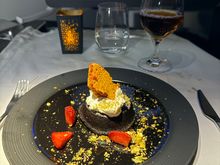Warm chocolate cake with honey, vanilla bean cream, fresh strawberries and chopped pistachio - 10/10 even the crew agreed it smelled divine. Big fan of these new warm desserts.