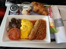 Muslim meal. Eggs were a bit dry. The sausage was the star. Best I’ve had on a plane. Very flavourful. 