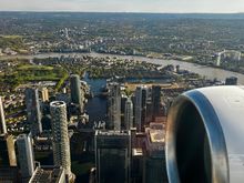 Overhead Poplar looking south over Canary Wharf and Millwall with Greenwich in the distance 