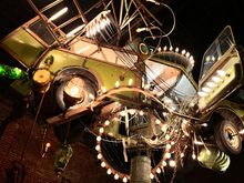 Ceiling art installation (the place used to be a auto garage)