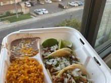 Casa de Mexico, seen in the background, small strip mall next door.