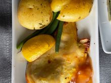 Undercooked potatoes; overcooked chicken and lemon, mystery sauce that looks like head cheese.