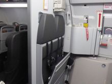 Two more cabin crew seats opposite the galley