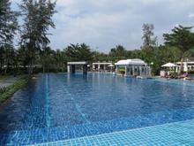 Infinity pool with swim up bar in background