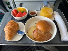 Breakfast Sandwich - brioche, Canadian bacon, cage free eggs, fontina, onion jam.  Pretty decent despite its appearance.  
Watermelon and kiwi were good, oranges were tart after eating the other two fruits.
Croissant with the jam and butter was good!