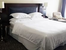 Electric outlets on each side of bed