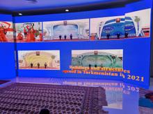 One wall is dedicated to a Powerpoint 97 slideshow about new buildings opened in Turkmenistan in 2021