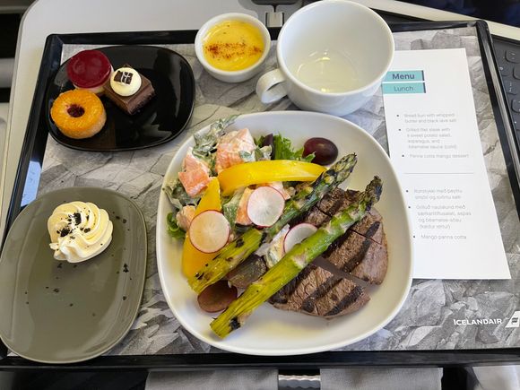 CDG-KEF Grilled Filet Steak with potato salad, asparagus, and sauce with bread and panna cotta mango