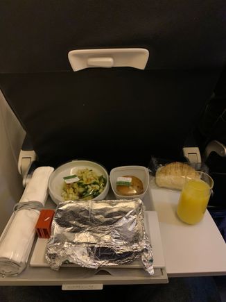 CDG-IST: tray came with all containers covered in plastic or foil. Also bread served separately in plastic; bubbly available
