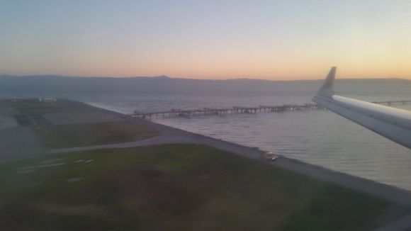 I fell asleep but soon after I looked out the window and saw the familiar view of 28L at SFO.