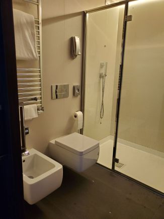Bathroom at the milan centric. Toilet, bidet, and shower.