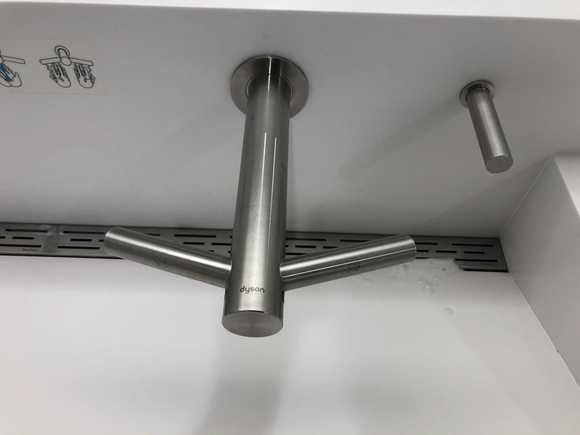 Modern faucet with built-in hand dryer.
