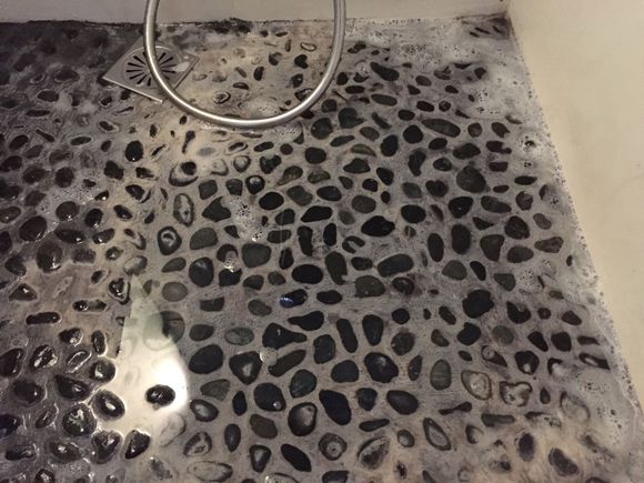 Water pooling in the shower.  It stayed there the whole night.