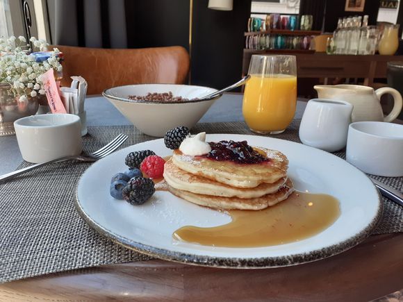 Pancakes with blueberry compot and maple syrup ( small pot of berries and creme friache provided also), ceral from the continental breakfast bar