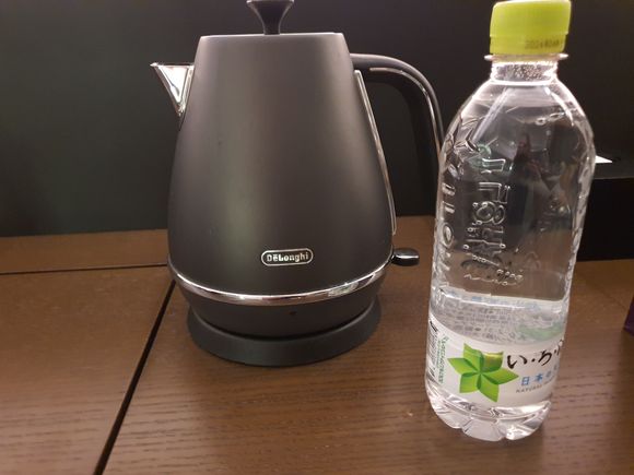 They moved the kettle and added a bottle of water for turndown service
