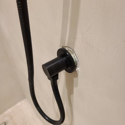 Unfinished wall on guest bathroom by the living room