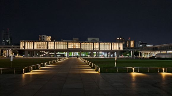 Looking back at the museum walkway from the cenotaph ( on previous visits the walkway lights have been switched off at night). Tents on the right in preparation for the early may flower festival)