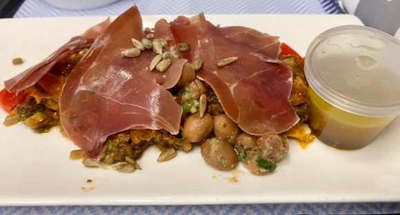 Lunch/cold dinner: Prosciutt﻿o,​ tomat﻿o​ date and​ feta salad, ​piquillo​ pepper, marinated borlott﻿i​ ​beans,​ toasted sun﻿flower​ seeds,​ rocket, ​honey​ cider olive oil​ dressing