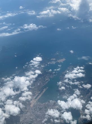 Here’s one from very far above.  Taken on a SYX-SHA flight in August 2020.   Not as nice as the OP’s photos but gives a good view of the Kowloon area from 30k feet.